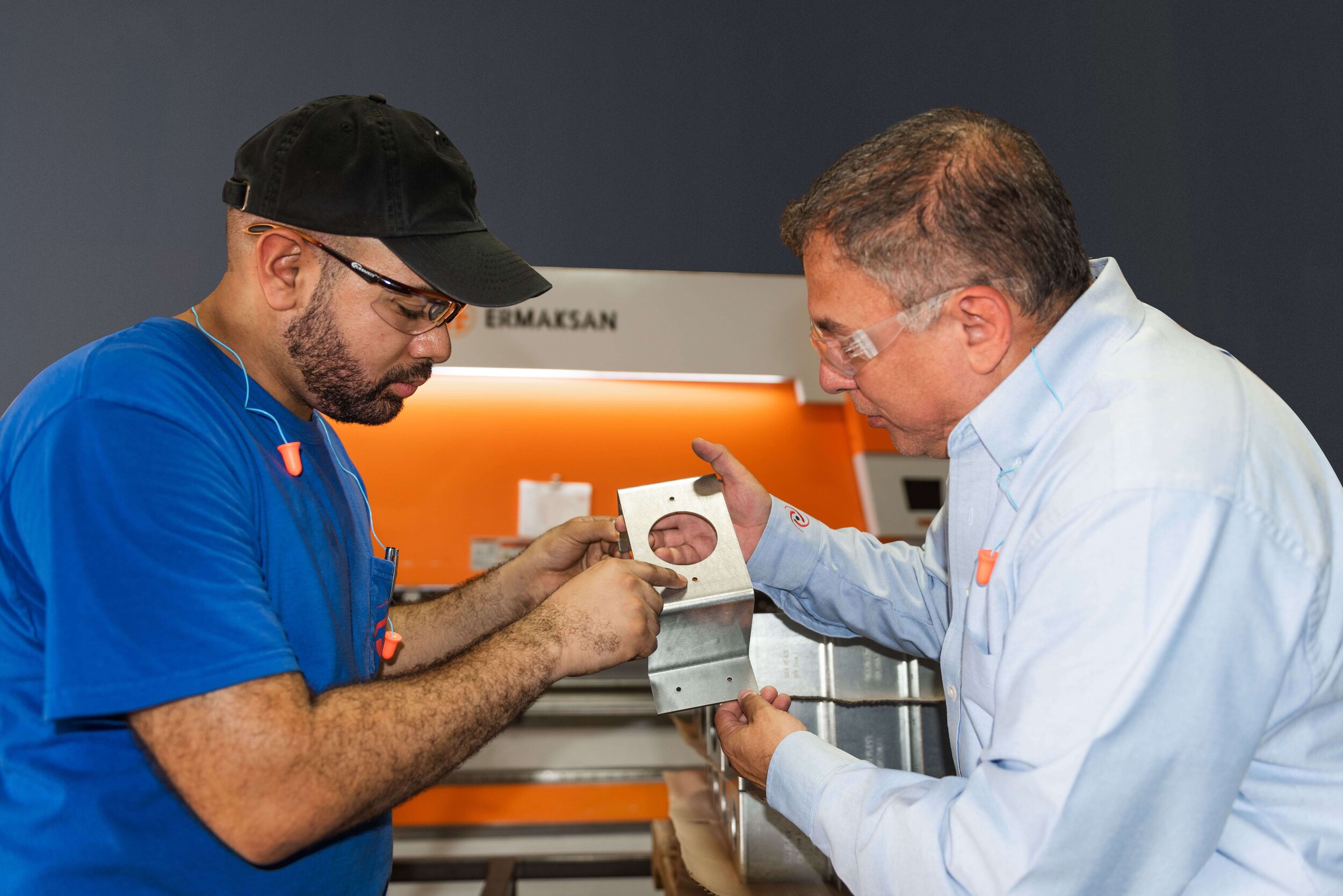 Gary & Norm inspecting part